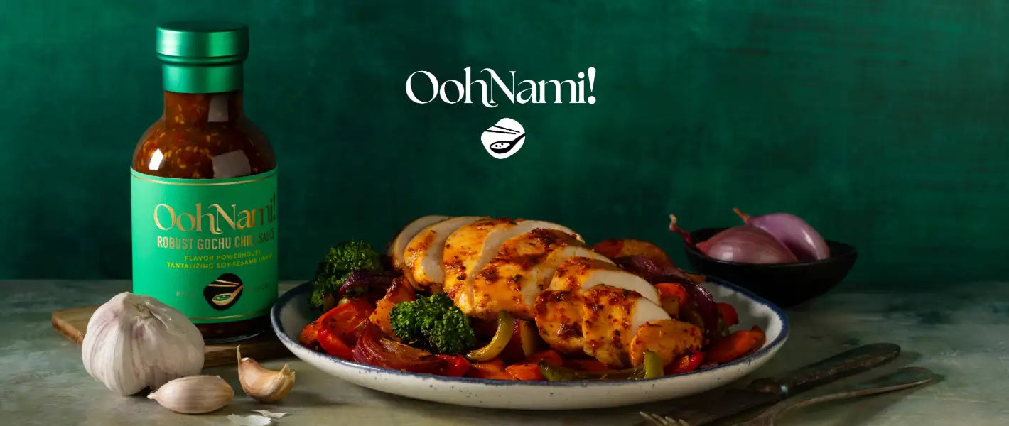 A bottle of oohnami! Bobot gochu cucumber sauce with a green label and metallic cap, filled with a vibrant reddish-brown liquid.