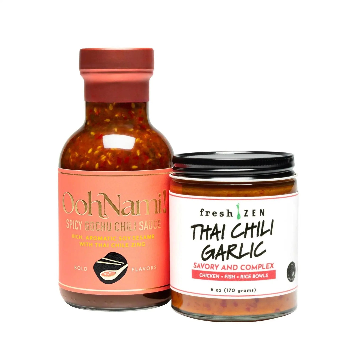 A glass jar with a black lid labeled ’fresh zen thai chili garlic’ in bold black text on a white label, containing an orange-red sauce.