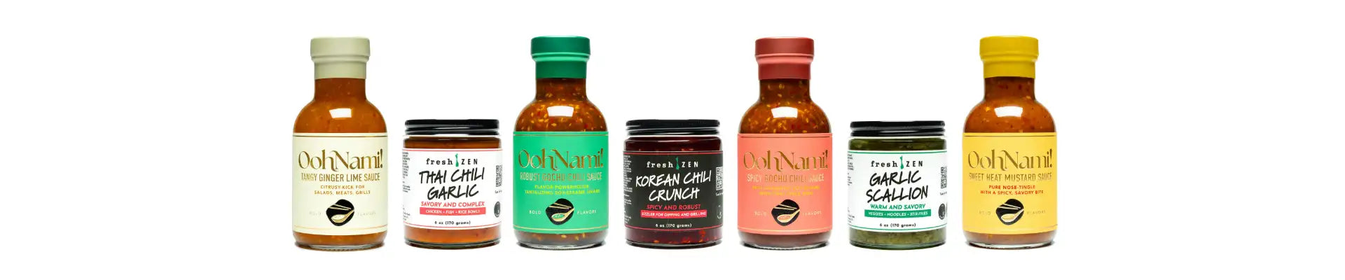 Six bottles of doonam! Brand salad dressings in various colors and flavors, including thai chili garlic, korean chili crunch, and sweet mustard.